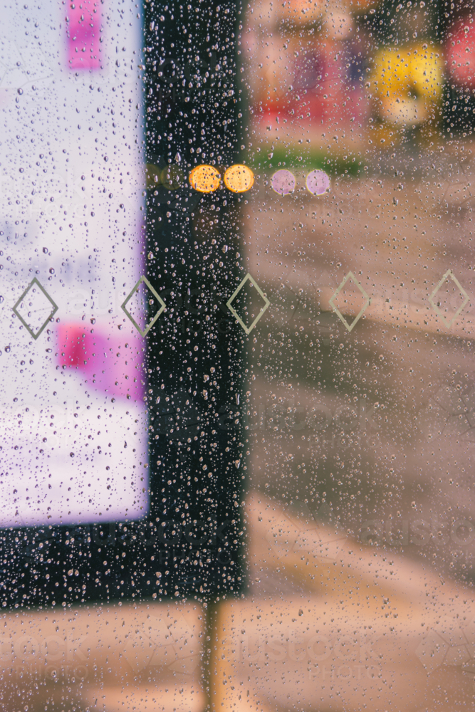 A Close up of Water Droplets on Glass on a Rainy Day - Australian Stock Image