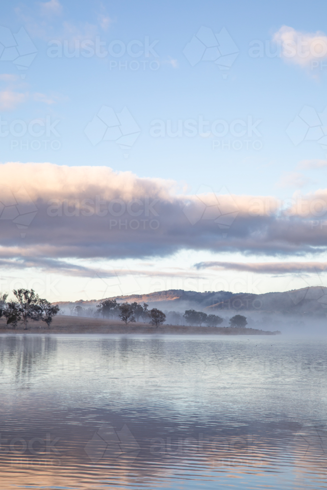 A cloudy sky over a country dam - Australian Stock Image