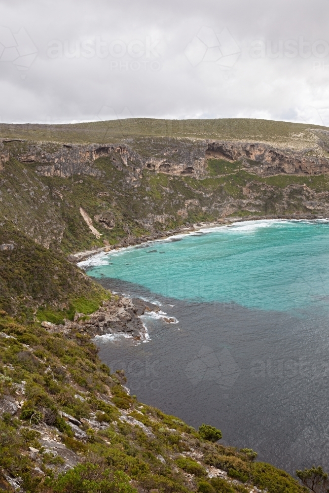 A coastal cliff overlooking the turquoise water - Australian Stock Image