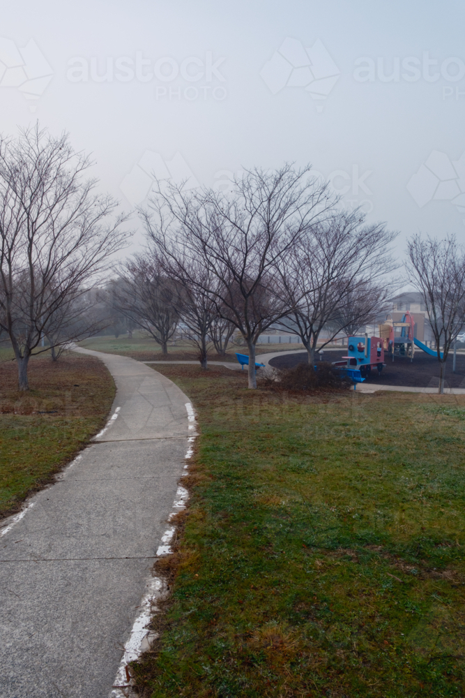 A Cold Foggy Morning in the Suburbs with a Play ground - Australian Stock Image