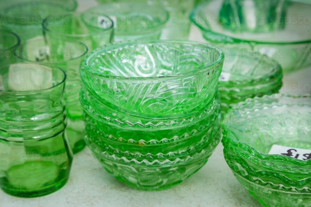Image of A collection of green glass crockery Austockphoto
