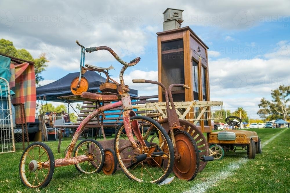 A collection of old trikes at a swap meet - Australian Stock Image