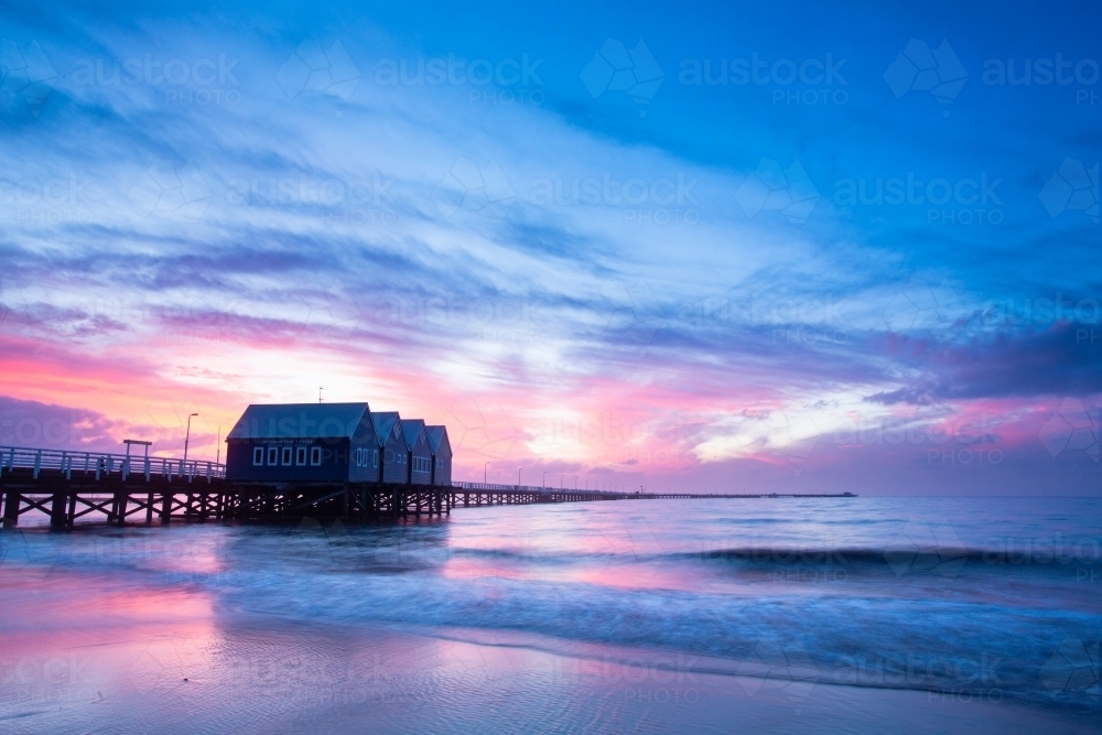 A colourful sunset behind the Busselton Jetty - Australian Stock Image