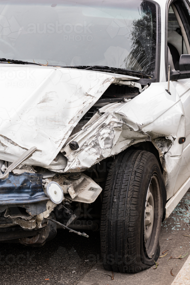 a crashed smashed car after an accident - Australian Stock Image