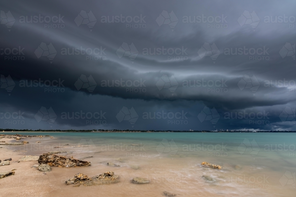 A dark shelf cloud approaches over the ocean - Australian Stock Image