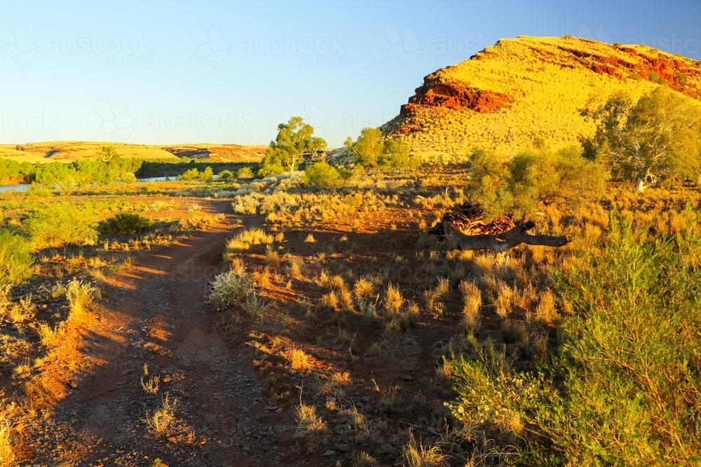 A dirt road leading to the Fortescue River in the Pilbara region - Australian Stock Image