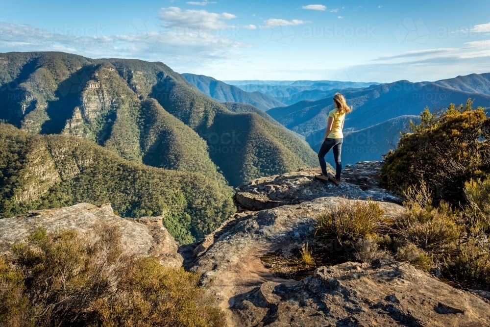 A female hiker exploring some of the wildest mountains Australia - Australian Stock Image