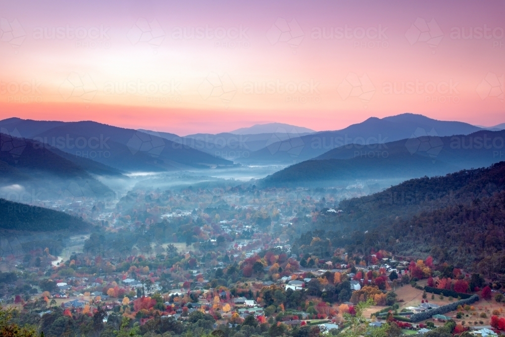 A foggy dawn looking over the autumn town in rural Australia - Australian Stock Image