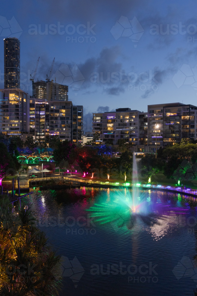 A fountain is lit up at night during an event at the Roma Street Parklands in Brisbane. - Australian Stock Image