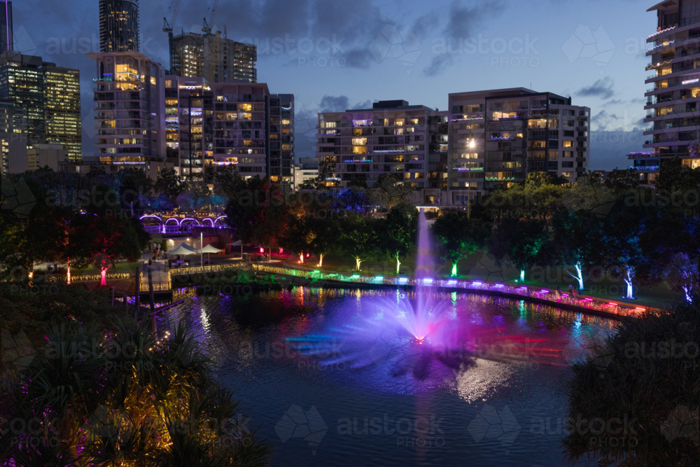 Image of A fountain is lit up at night during an event at the Roma ...