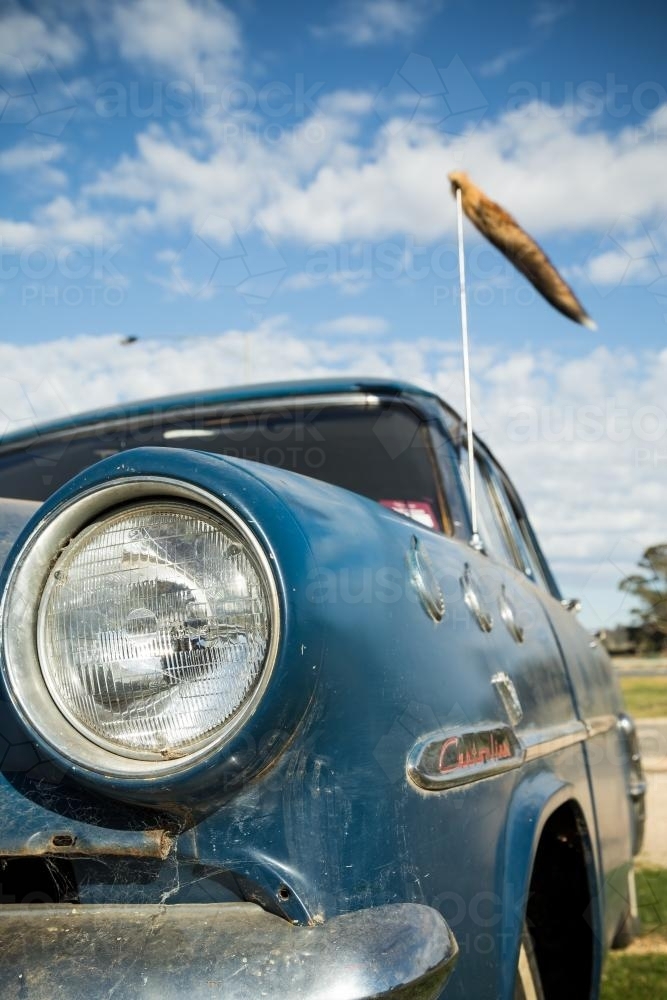 A fox tail flying from an old car's antenna - Australian Stock Image