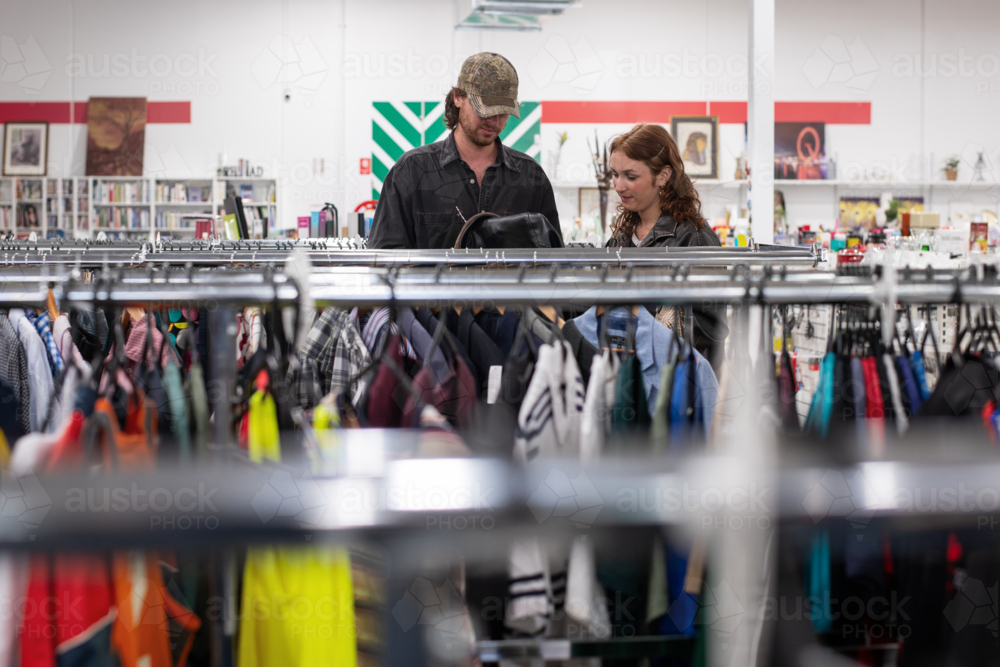 a genZ couple shopping in a thrift store - Australian Stock Image