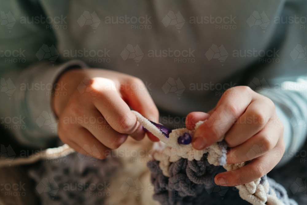 A girls hands crocheting - Australian Stock Image