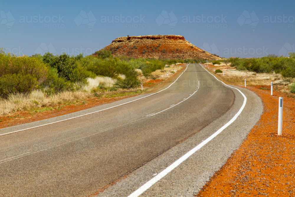 A highway view of a tabletop hill in the Pilbara - Australian Stock Image