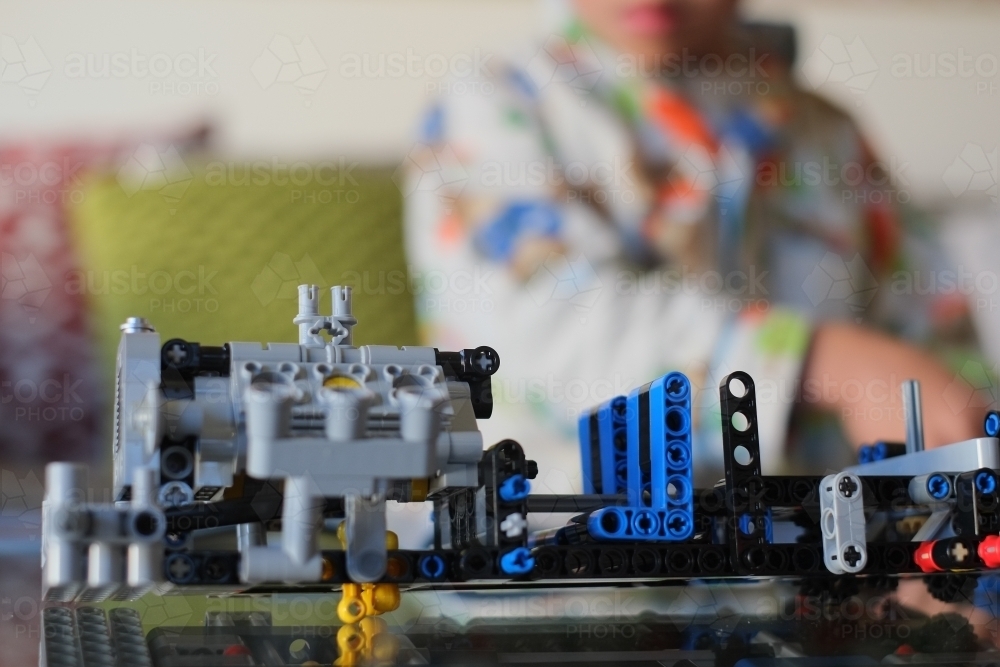 a kid building a Lego piece - Australian Stock Image