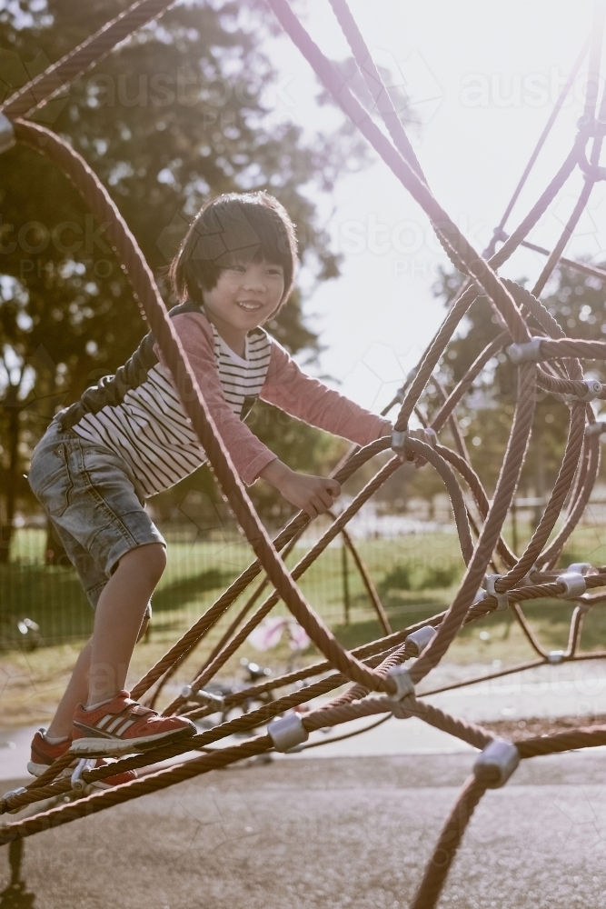 Image Of A Kid Climbing Up A Net Tower As The Sun Sets Austockphoto Image Of A Kid Climbing Up A Net Tower As The Sun Sets Austockphoto