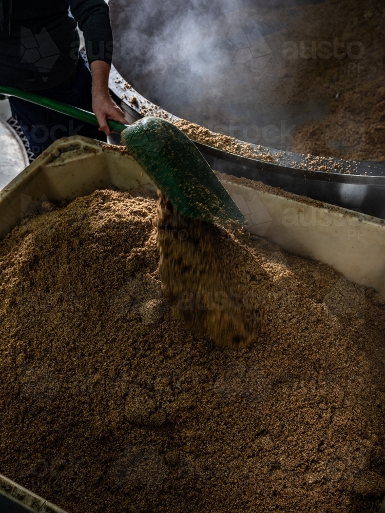 A large container being filled with grain - Australian Stock Image