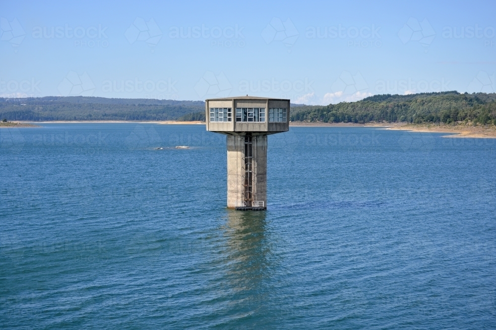 A large control tower in a freshwater reservoir - Australian Stock Image