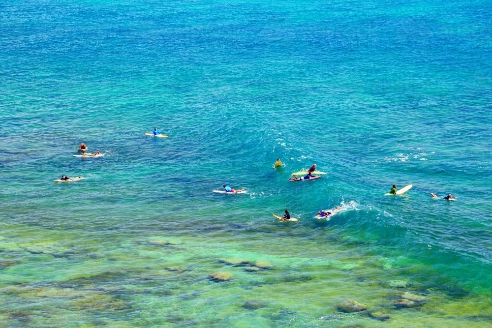 A large group of surfers at Moffat Beach, Caloundra, on the Sunshine Coast - Australian Stock Image
