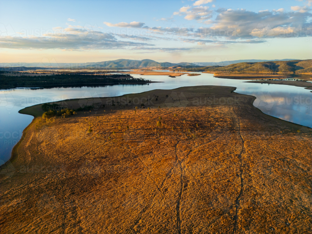 A large paddock stretching into Lake Wivenhoe - Australian Stock Image