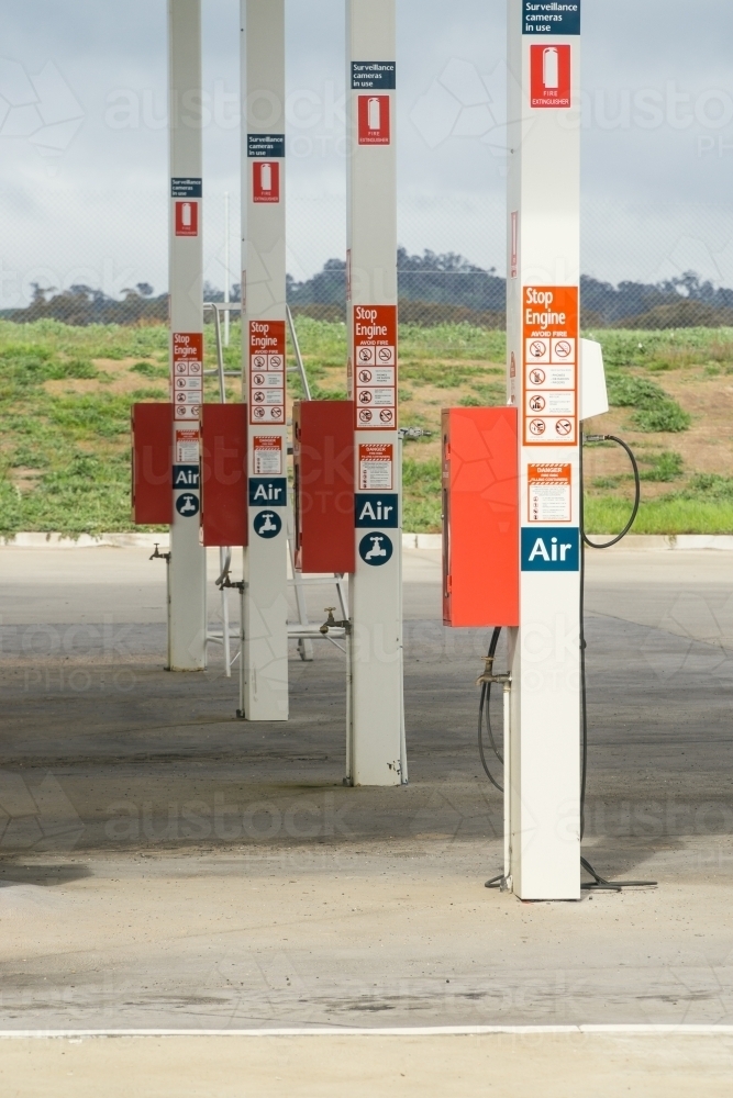 A line of poles with air hoses, at a truck stop - Australian Stock Image