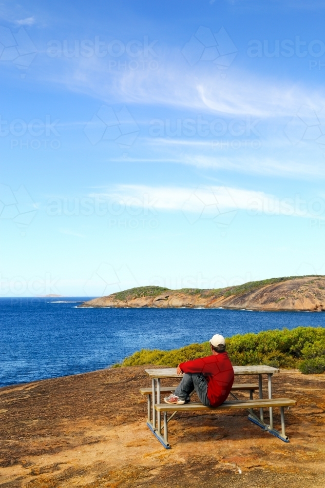 A man in his 40's enjoying the ocean view. - Australian Stock Image
