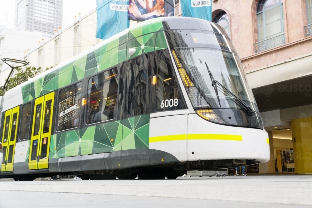 A modern city tram on a Melbourne street - Australian Stock Image