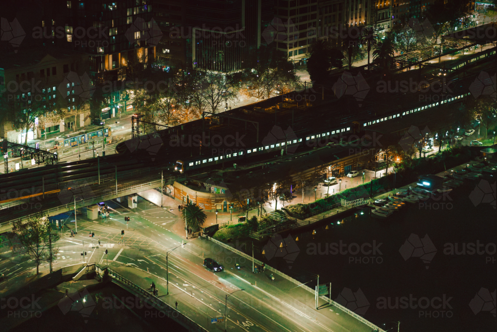 A moody nighttime cityscape along the coast. - Australian Stock Image