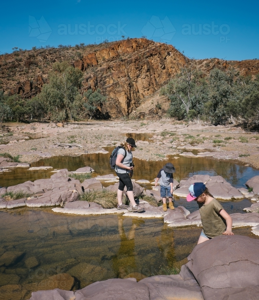 A mother and two kids trekking through the Flinders Ranges - Australian Stock Image