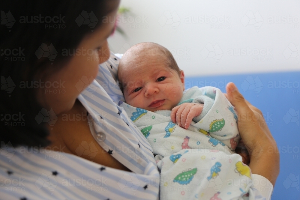 A mother holding her newborn baby - Australian Stock Image