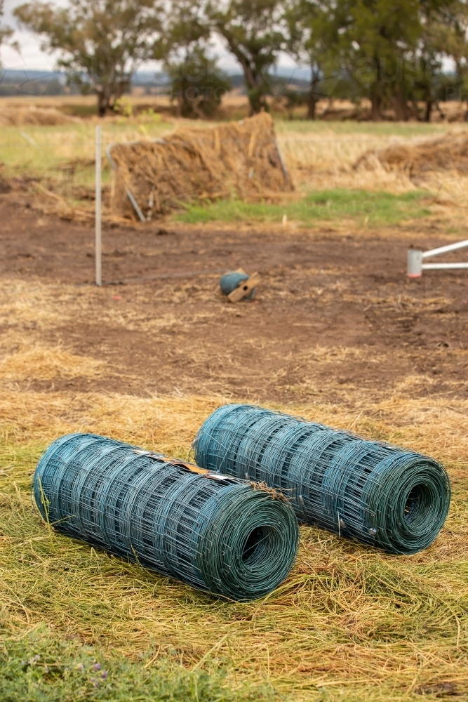 A new fence begins after a flood - Australian Stock Image