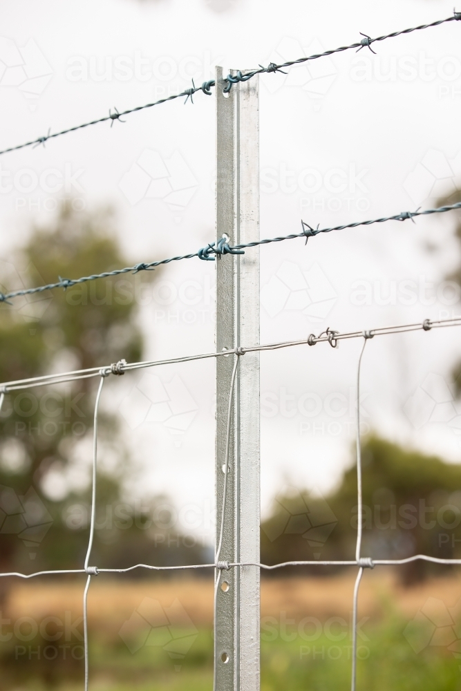 A new fence with barbed wire - Australian Stock Image