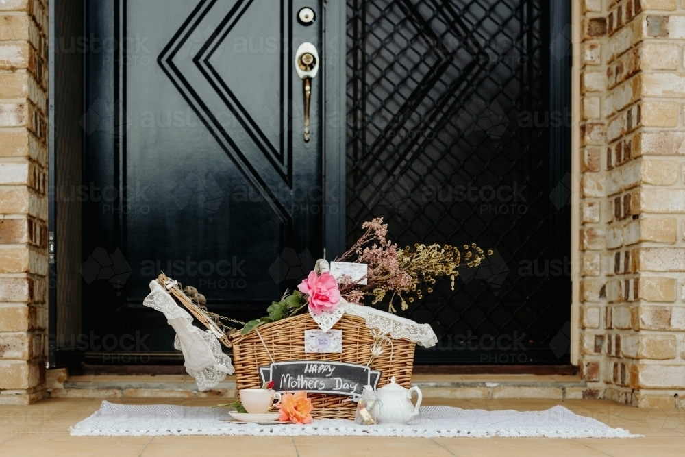 A picnic hamper delivered to a front porch - Australian Stock Image