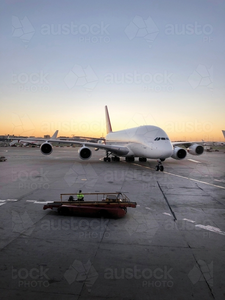 A plane sitting on the tarmac - Australian Stock Image