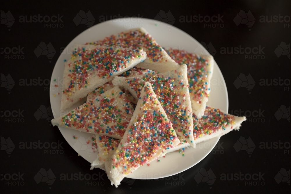 a plate of fairy bread, bread buttered and then sprinkled with sprinkles - Australian Stock Image