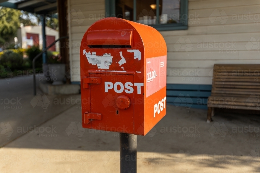 A red australia post letter box stripped of all branding and logos. - Australian Stock Image