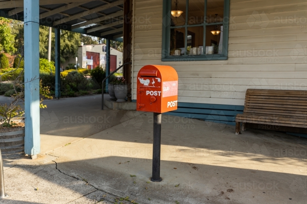A red australia post letter box stripped of all branding and logos. - Australian Stock Image