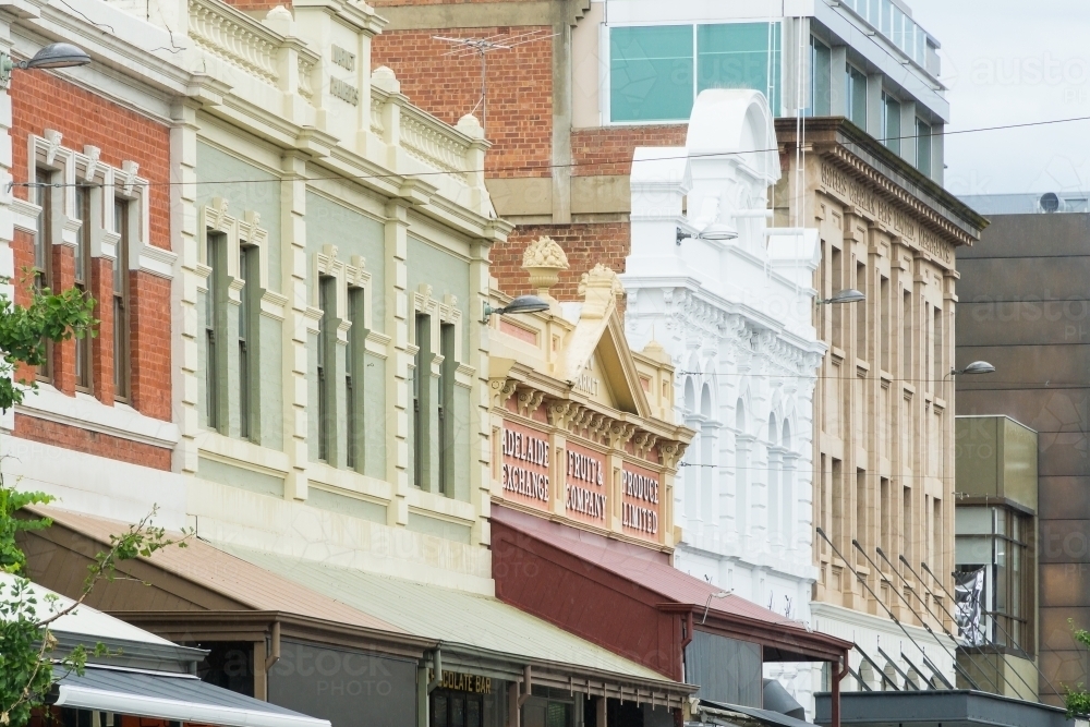 A row of historic building facades painted in different colours - Australian Stock Image