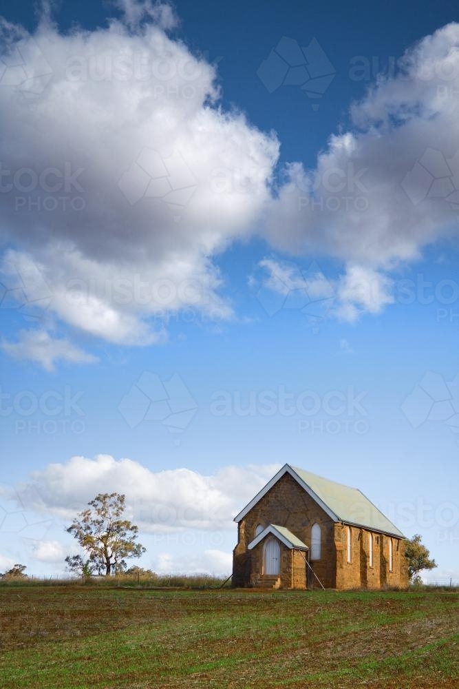 A small country church under a cloudy sky - Australian Stock Image