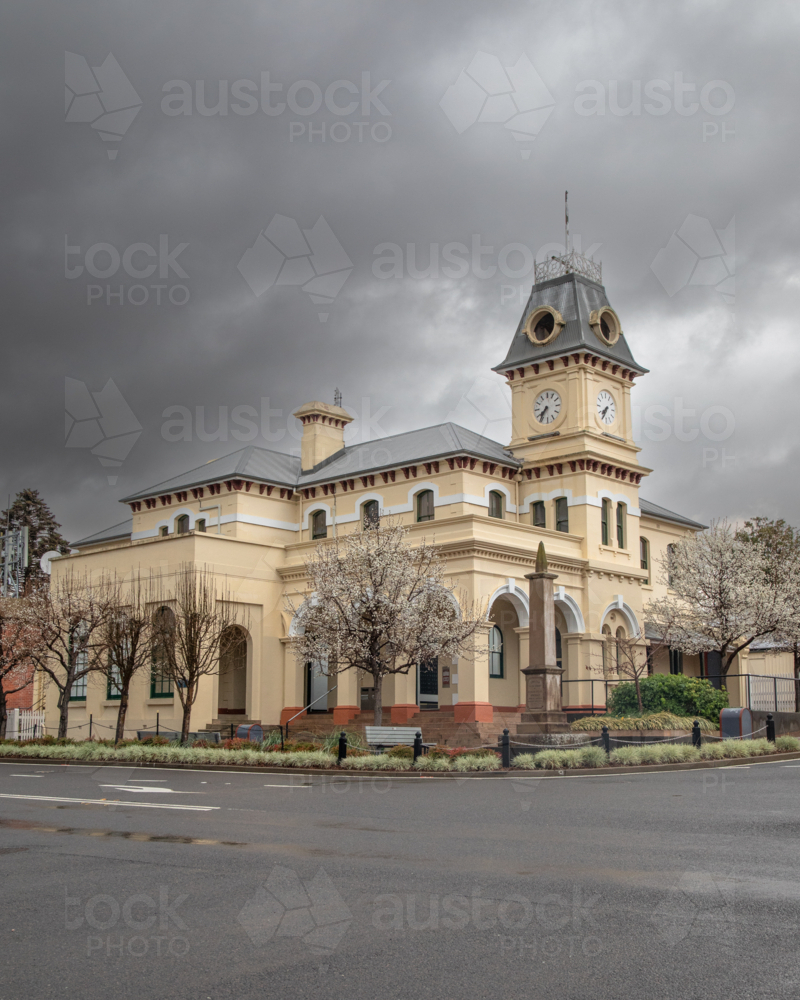 A small town country Post Office building under a stormy grey sky - Australian Stock Image