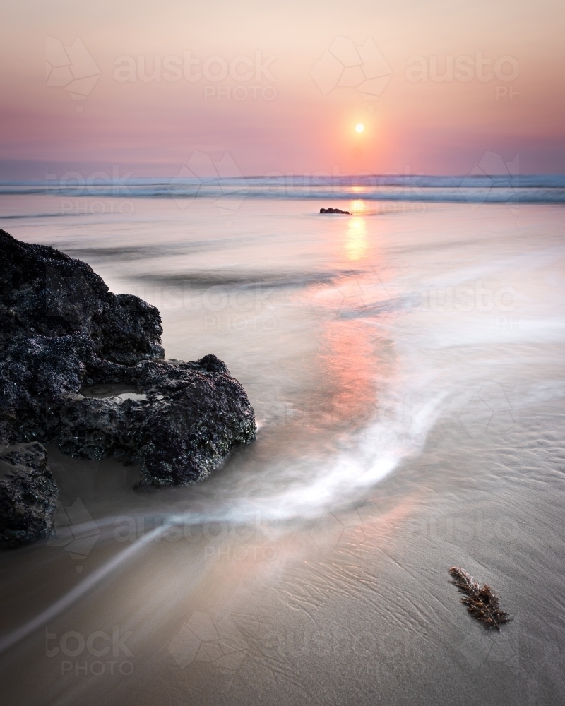 A Smokey Pink Sky Sunrise at Low Tide on the Great Ocean Road - Australian Stock Image