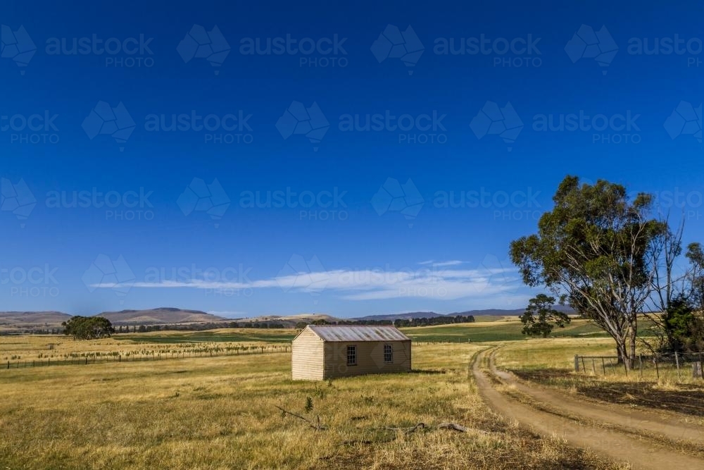 A solitary shed on farm land. - Australian Stock Image