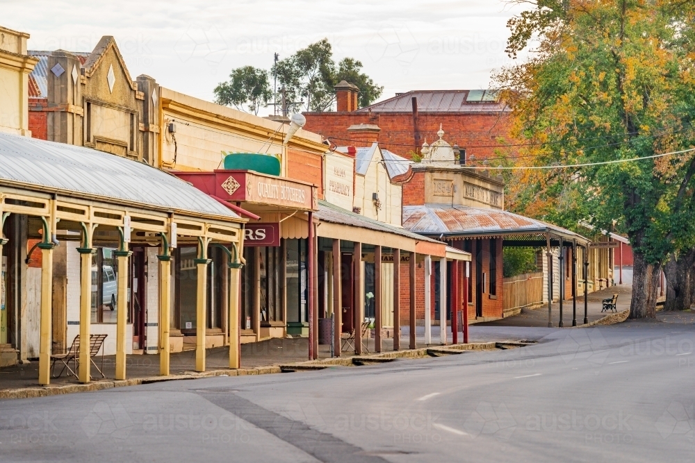 A streetscape of historic shop fronts with wide verandas - Australian Stock Image