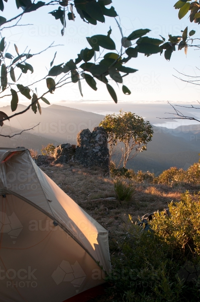 A tent and camp overlooking mountain range - Australian Stock Image