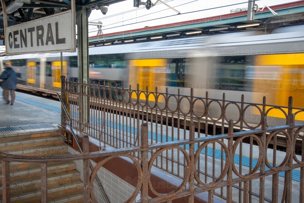 A train travels through Central Station in Sydney with motion blur - Australian Stock Image