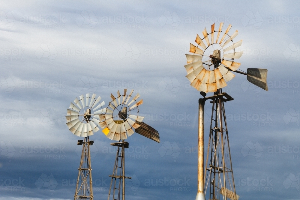 A trio of rusted outback windmills - Australian Stock Image