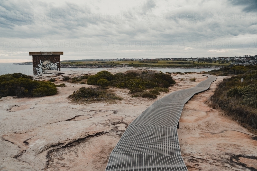 Image of A walking track leading down to Malabar at Boora Point, Malabar. Austockphoto