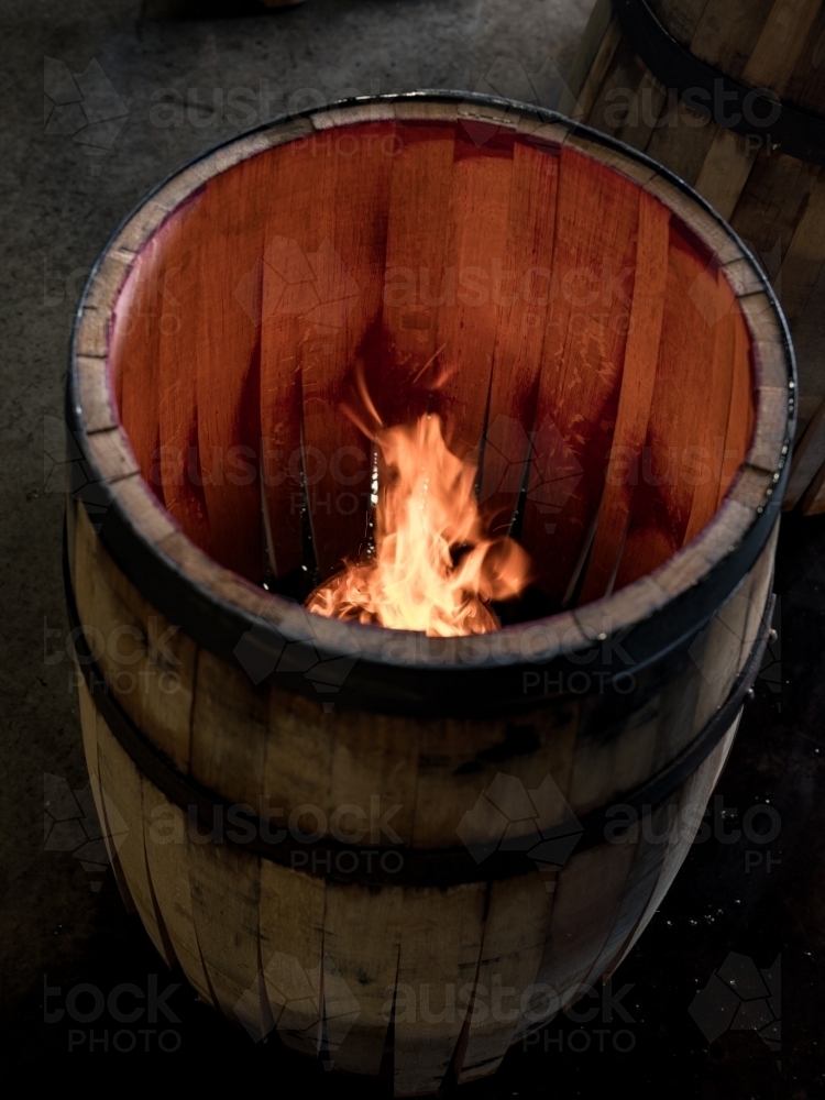 A whisky barrel being charred for storage - Australian Stock Image