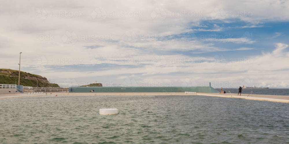 A wide view of the Newcastle Ocean Baths showcasing the expansive saltwater pool - Australian Stock Image