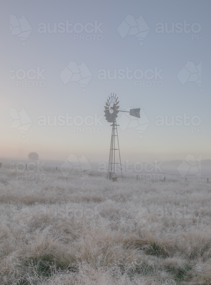 A windmill in a frozen field - Australian Stock Image